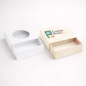 Two drawer-style boxes with circular windows, one plain white and one with a cream damask pattern.