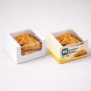 Personalised croissant boxes featuring custom brand logos and vibrant colours for a professional bakery aesthetic.