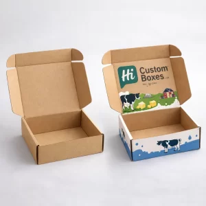 Two upright carton boxes with open top flaps, one plain white and one featuring milk splashes.