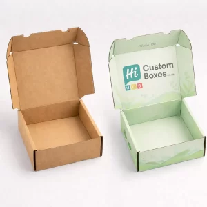 Two small, open square mailer boxes: one natural brown kraft and one printed with green leaves.