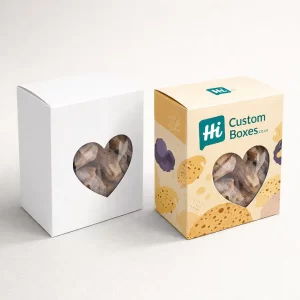Two biscuit gift boxes featuring a heart-shaped window, with one box displaying a cream pattern.