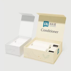 Two premium rigid gift boxes opened to reveal custom inserts holding white conditioner bottles and accessories.