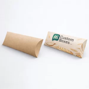 Unique pillow-shaped baguette boxes made from eco-friendly kraft paper with custom bakery logo and graphics.