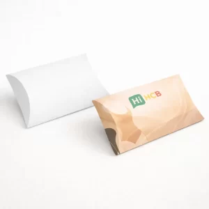 Unique pillow style shapewear boxes with curved edges and a delicate ribbon pull for a luxury feel.