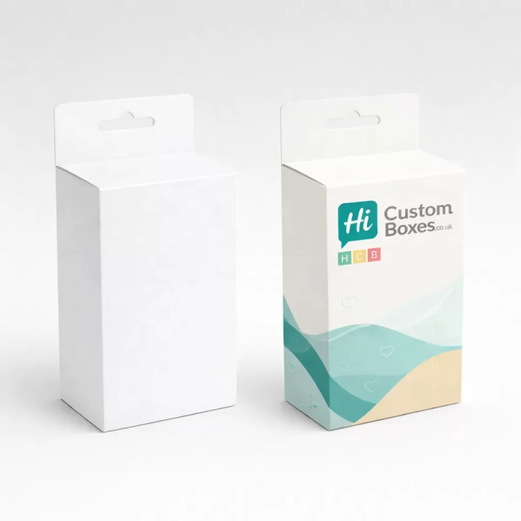 Two square white boxes, one plain and one printed with a circular window showing a garment.