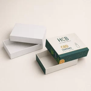 Two sleek black and gold branded boxes featuring vibrant terpene profiles and artistic leaf designs.