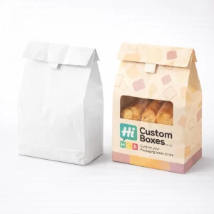 Two paper food bags with a fold-over top, one plain white and one patterned yellow.