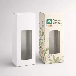 Two white retail cartons with cutout windows, one blank and one featuring blue floral patterns.