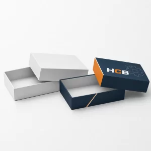 Pair of premium drive sprocket boxes in black and blue with clean, professional branding designs.