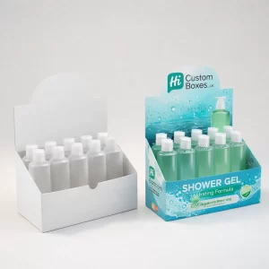 Two cardboard retail display units holding rows of small green bottles, one plain white and one branded.