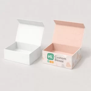 A pair of open rigid gift boxes, one in plain white and one with a pink illustrated pattern.