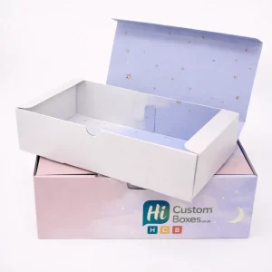 A large lilac box with a night-sky interior and a plain white lid resting on top.