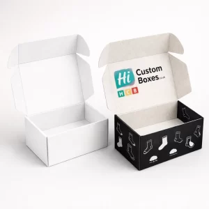 Open mailer style boxes showing a plain white interior and a custom printed black exterior.