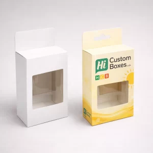 Two retail cartons with cutout windows, one plain white and one featuring yellow sunscreen branding.