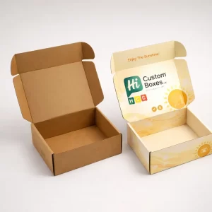 Two open cardboard mailer boxes, one plain brown and one custom printed with sun graphics.