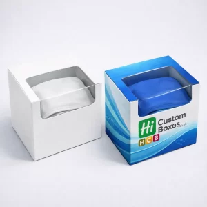 A stack of premium cardboard swimming cap boxes featuring minimalist branding and a smooth matte finish.