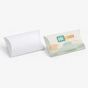 Two horizontal pillow boxes for t-shirts, one plain white and one with colourful brand illustrations.