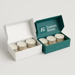 Small open white box and decorative teal box each containing four metal-cased tealight candles.