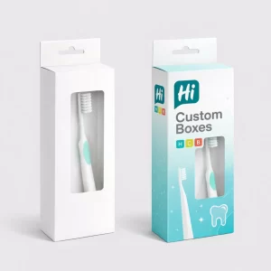Two cardboard toothbrush boxes with hang tabs and windows- one plain and one branded