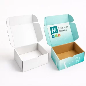Two open cardboard mailer boxes- one blank white and one with teal branding inside