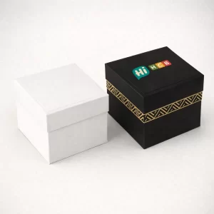 Two square rigid gift boxes featuring detachable lids, gold geometric patterns, and a custom logo.