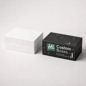 Two premium two-piece rigid boxes, one plain white and one black featuring gold starry decorative elements.