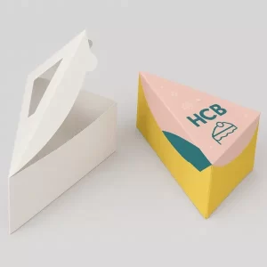 Two triangle cake slice boxes one plain white with window one colourful with HCB logo and cake icon