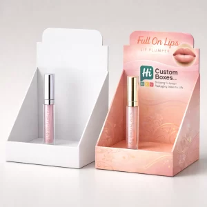 Two cardboard counter display units showcasing lip plumper tubes, one plain white and one fully branded.