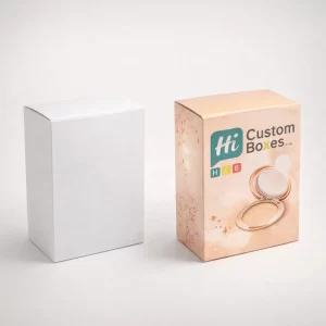 Two upright rectangular product boxes, one plain white and one peach-coloured with a highlighter compact illustration.
