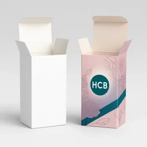 Two open boxes- left is white with shredded paper- right is teal with floral pattern