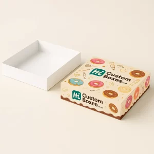Two open donut boxes, one kraft with plain glazed donuts and a window, the other custom branded with "Hi Custom Donuts," colorful graphics, and assorted donuts.