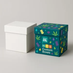 Two square, two-piece rigid boxes for edibles packaging, one plain white and one printed with a colourful pattern.