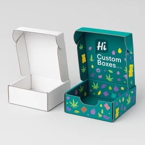 Two open mailer-style boxes for edibles packaging, one plain white and one fully printed with a colourful leaf and candy pattern.