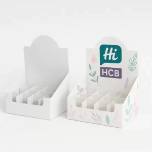 Two display-style boxes with circular insert cutouts, one plain white and one in pink, teal, and purple with Hi Custom Boxes branding on raised back panel.