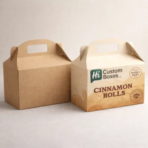 Two gabled gift boxes with integrated handles, one plain brown kraft and one with decorative cinnamon-themed branding.