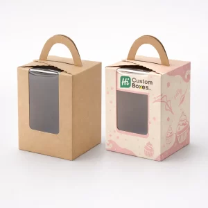 Tall brown kraft and decorative pink cake boxes with integrated handles and clear front viewing windows.