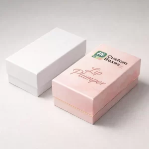 Two sturdy rectangular boxes for lip plumpers, one plain white and one pink with floral patterns.