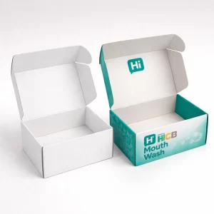 Two open cardboard mailer boxes- one plain white and one with teal mouthwash branding