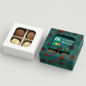 White and branded boxes with windows, holding four different chocolate truffles and inserts.