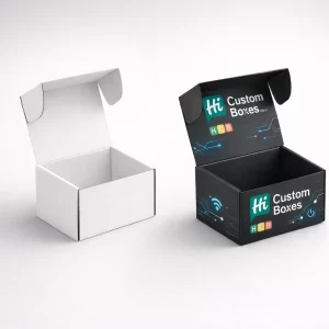 Two small cardboard mailer boxes with open lids, one in plain white and one with black custom branding.