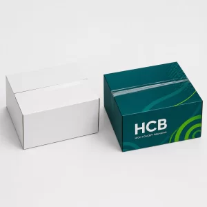 Closed corrugated shipping boxes in plain white and teal branded designs.