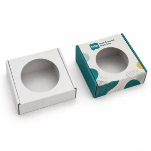 Square white and branded boxes featuring a circular die-cut window for enhanced product visibility on retail shelves.