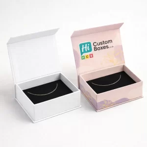 Branded magnetic flip-top anklet boxes in minimalist white and decorative pink with black velvet lining
