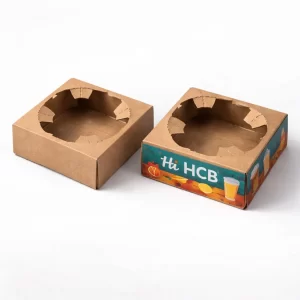 Two open cardboard mailer boxes, one plain brown and one featuring custom green beverage branding.