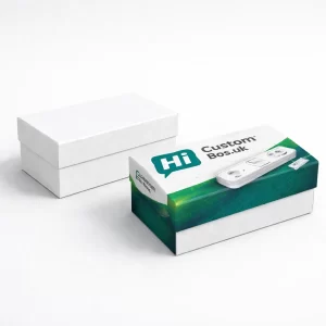 Two rectangular gift-style boxes, one plain white and one featuring a green extension lead design.