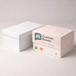 Two premium rigid gift boxes, one plain white and one with pink floral patterns and branding.