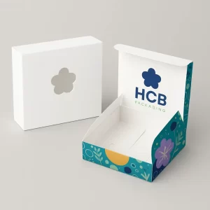 White and assembled die-cut soap boxes with flower windows and colourful inner printing