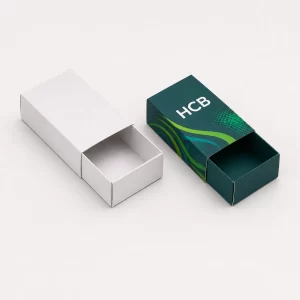 Sliding sleeve cardboard boxes in white and teal branded designs.