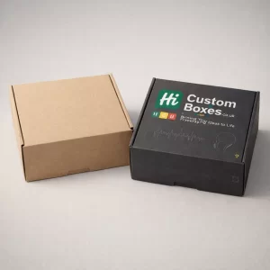 A plain brown biodegradable mailer box next to a black eco-friendly box with printed white graphics.