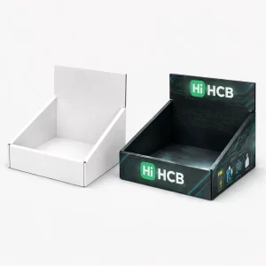 Open-front cardboard display boxes, one in plain white and another with dark branding for shop counters.